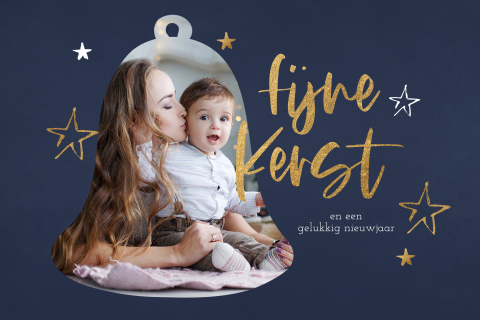 Kerstkaart met babyfoto in kerstklok en sterren