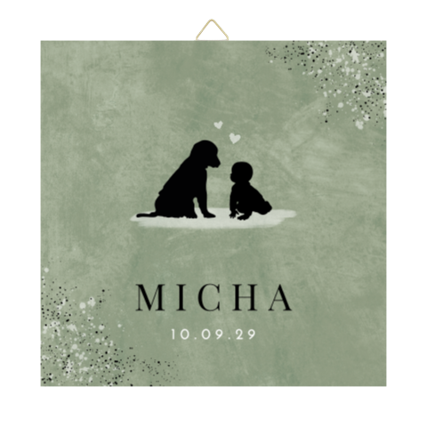 Groen tegeltje met silhouetjes hond en baby