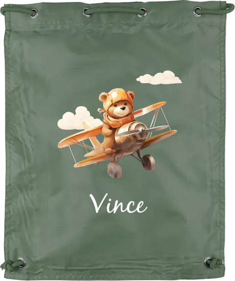 Gymtas met lief beertje in vliegtuig