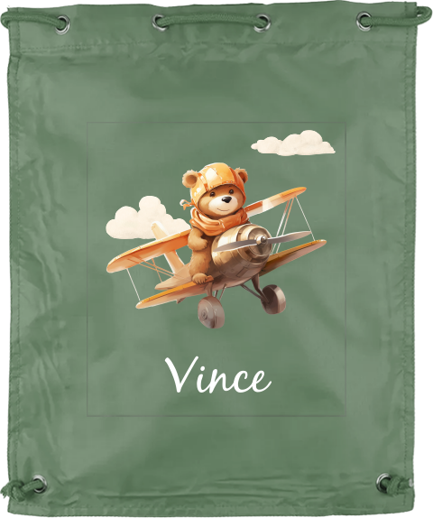 Gymtas met lief beertje in vliegtuig