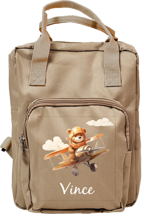 Rugzak met lief beertje in vliegtuig