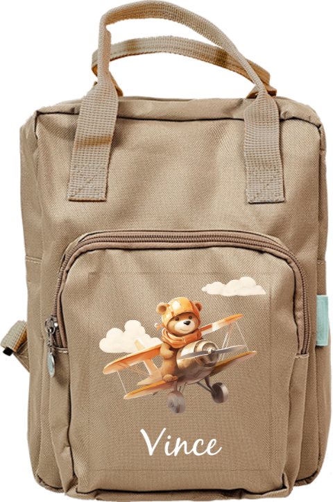 Rugzak met lief beertje in vliegtuig