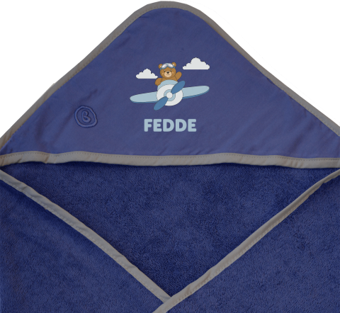 Badcape met naam en beertje in vliegtuig