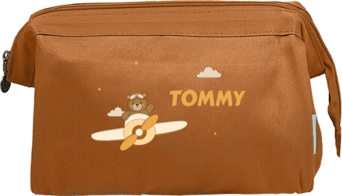 Toilettas met beertje in vliegtuig en naam