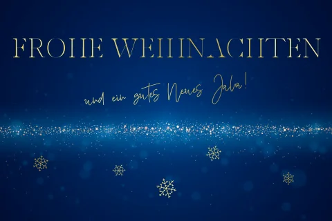 Weihnachtskarte mit blauem Hintergrund und Schneeflocken