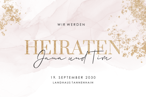 Hochzeitskarte mit zartrosa Wasserfarbe und goldenen Tupfen