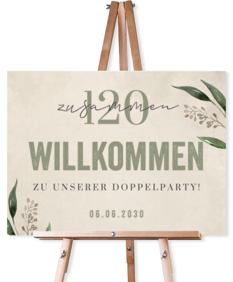 Willkommensschild zum 120. Doppelgeburtstag mit grüner Schrift und Zweigen