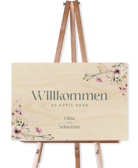 Florales Willkommensschild mit rosa Blumen und Typografie aus Holz