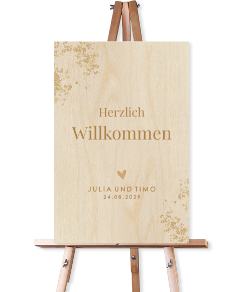 Willkommensschild zur Hochzeit aus Holz mit Goldspritzern und Herz