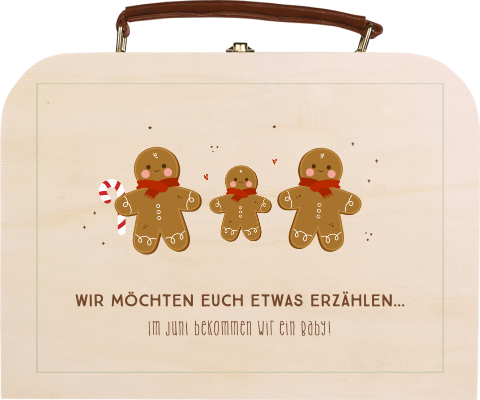 Kinderkoffer als Schwangerschaftsankündigung mit Lebkuchenmänner
