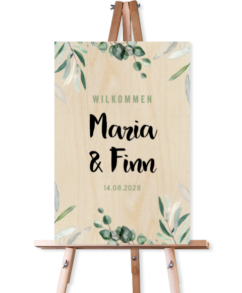 Botanisches Willkommensschild zur Hochzeit aus Holz mit verspielter Schrift und Blätterzweigen