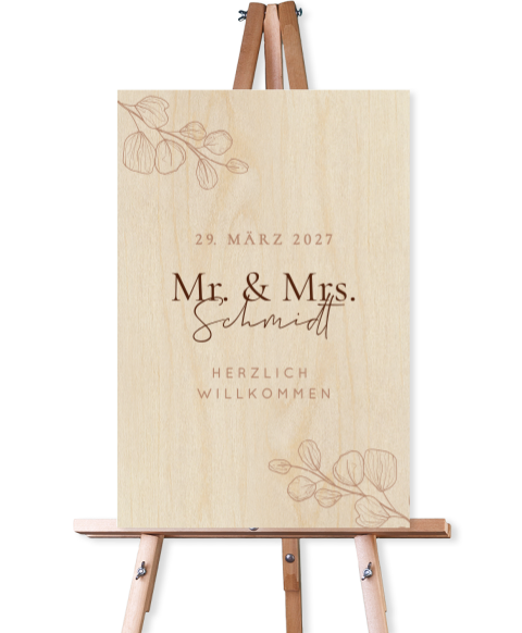 Schlichtes Willkommensschild zur Hochzeit aus Holz mit Blättern